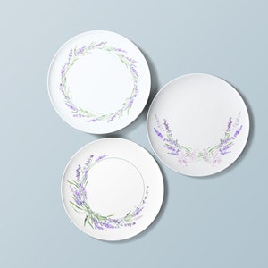 May include: Three white ceramic plates with lavender floral designs. The plates have a simple, elegant design with lavender flowers and leaves.