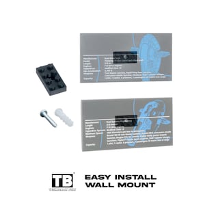 May include: A black plastic building block, a metal screw, a white plastic wall anchor, and two rectangular gray display plaques featuring technical specifications for a spacecraft, including text and line art. Below, the text reads EASY INSTALL WALL MOUNT.
