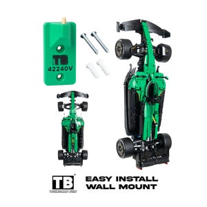 May include: A green plastic wall mount bracket labeled TB 42240V, two metal screws, two white plastic wall anchors, and a green and black model race car. The text TB TECHNICALLY BUILT EASY INSTALL WALL MOUNT is displayed at the bottom of the image.