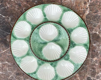 Longchamp: 1 shellfish dish with relief decoration of scallops and caning.