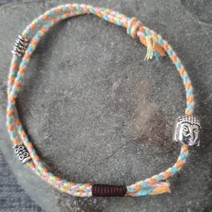 Tibetan Buddha/lucky charm bracelet