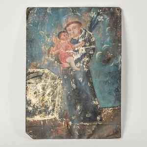 Mexican Retablo Painting of St. Anthony of Padua holding the Christ Child Circa 19th century