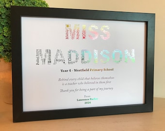 May include: A framed print with a colourful word cloud spelling "Miss Maddison" with the words "Year 4 - Westfield Primary School" below. The print includes a quote: "Behind every child that believes themselves is a teacher who believed in them first. Thank you for being a part of my journey. From Lawrence Parker 2024."