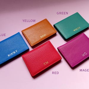 Slide showing the colors available with the wallets labled- blue, yellow, green, red and magenta.