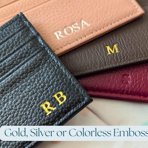 Close up of emboss options - gold, silver, and colorless.