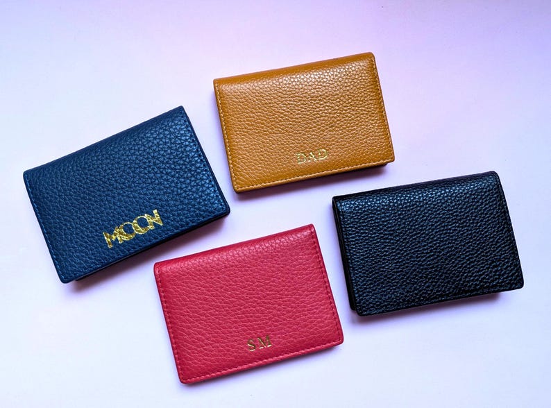 Genuine Leather Business Card Holders in blue, yellow, red and black. With custom logo or custom initials with a monogram emboss.