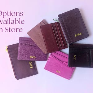 Options Available in Store: Featuring berry colored card holders in various styles.