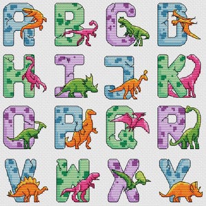 May include: A cross-stitch alphabet featuring colorful dinosaurs inside each letter. The letters are in shades of blue, green, and purple, with a cracked stone texture. Each letter has a different dinosaur in orange, pink, and green.