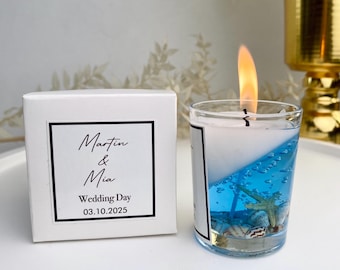 Recuerdos personalizados de velas para bodas en la playa: Vela de gel con forma de concha marina