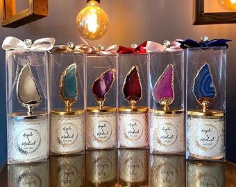 May include: Six clear glass candle jars with gold lids and agate stone tops. Each jar has a white label with the text "Angela & Michael 08.06.2022".