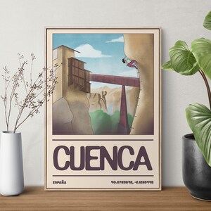 May include: A vintage travel poster with a cartoon illustration of a building on a cliff with a bridge connecting to another cliff. The poster is titled "CUENCA" with the text "ESPAÑA" and coordinates below.