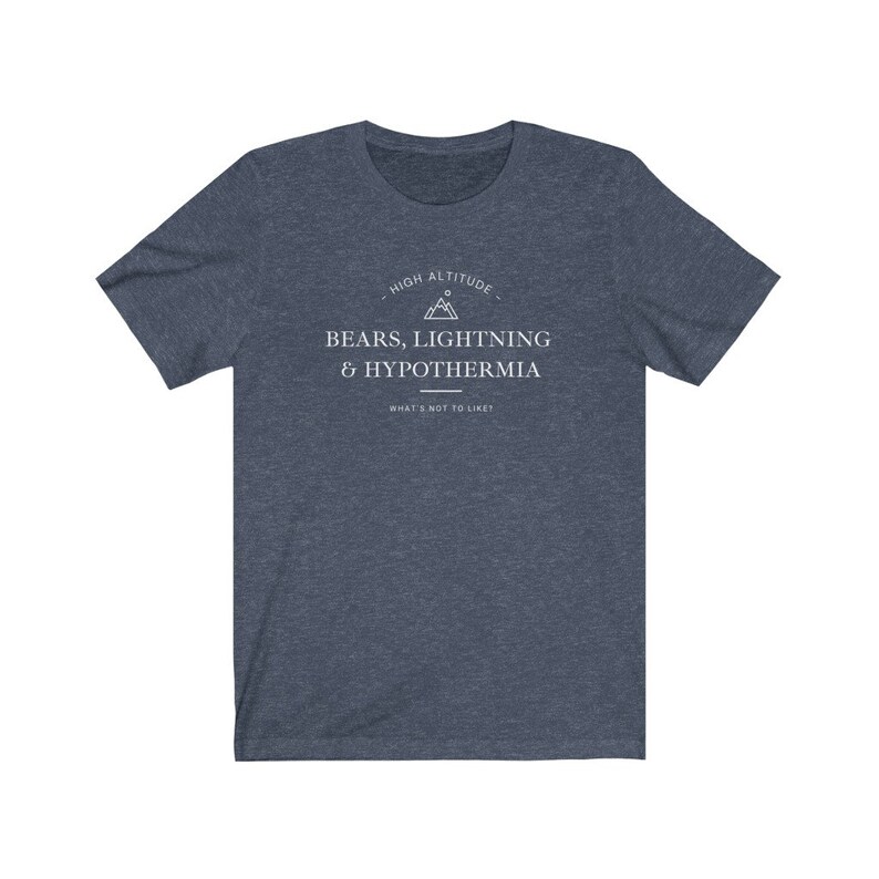 May include: A dark blue t-shirt with a white graphic design that says "High Altitude - Bears, Lightning & Hypothermia - What's not to like?"