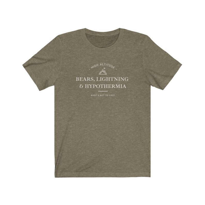 May include: A green t-shirt with a white graphic that says "High Altitude - Bears, Lightning & Hypothermia - What's not to like?" The graphic also includes a mountain peak symbol.
