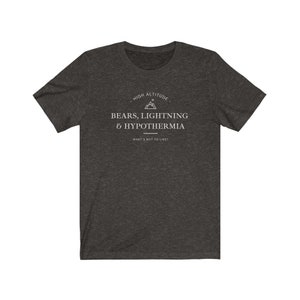 May include: Dark heather grey t-shirt with a white graphic design that says "High Altitude - Bears, Lightning & Hypothermia - What's not to like?"