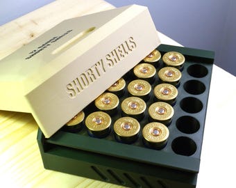 Caja de almacenamiento para cartuchos cortos de calibre 12: tapa magnética, organizador de munición compacto.