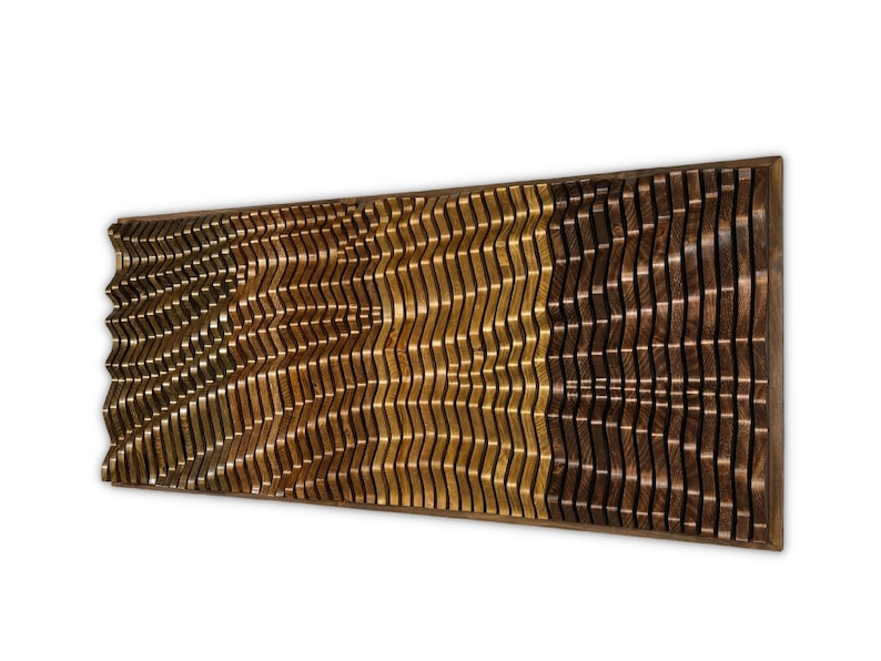 May include: A wall-mounted wooden art piece with a wavy pattern. The piece is made of different shades of brown wood, creating a layered effect.