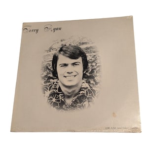May include: Vintage vinyl record album featuring a black and white portrait of Terry Ryan. The album cover is a light beige color with the artist's name at the top and the album title at the bottom.