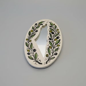 Decorative letter 'V' with floral patterns on a white background