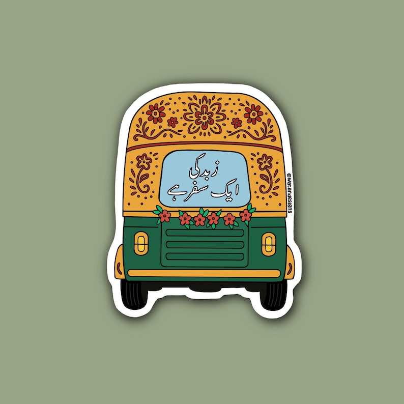 May include: A sticker featuring a colorful auto-rickshaw design. The vehicle is primarily green with a yellow roof adorned with floral patterns. The windshield displays text in a foreign language, and red flowers decorate the front.