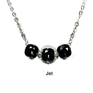 Three Crystal Necklace with a Swarovski Stone Surrounded by Rhinestones and Two Swarovski Crystals a Silver Chain.