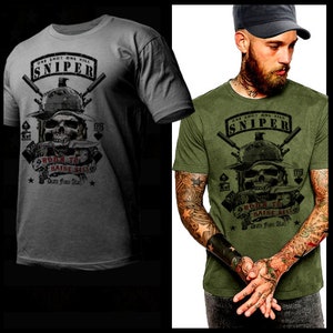 May include: A gray and green t-shirt with a skull graphic and the text "One Shot One Kill Sniper Born To Raise Hell Dead From Steel".