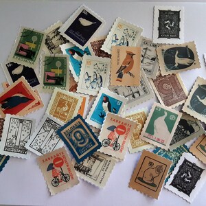 May include: A collection of vintage postage stamps featuring various designs, including birds, animals, and geometric patterns. The stamps are in different colors and sizes, and some have text in Cyrillic and other languages.