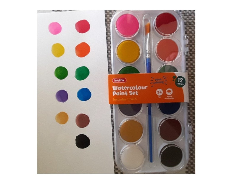 May include: A set of 12 watercolor paints in a plastic case with a brush. The paints are in round pans and are arranged in rows of four. The colors are pink, orange, green, purple, brown, and black. The case is labeled "Watercolour Paint Set" and includes a brush.