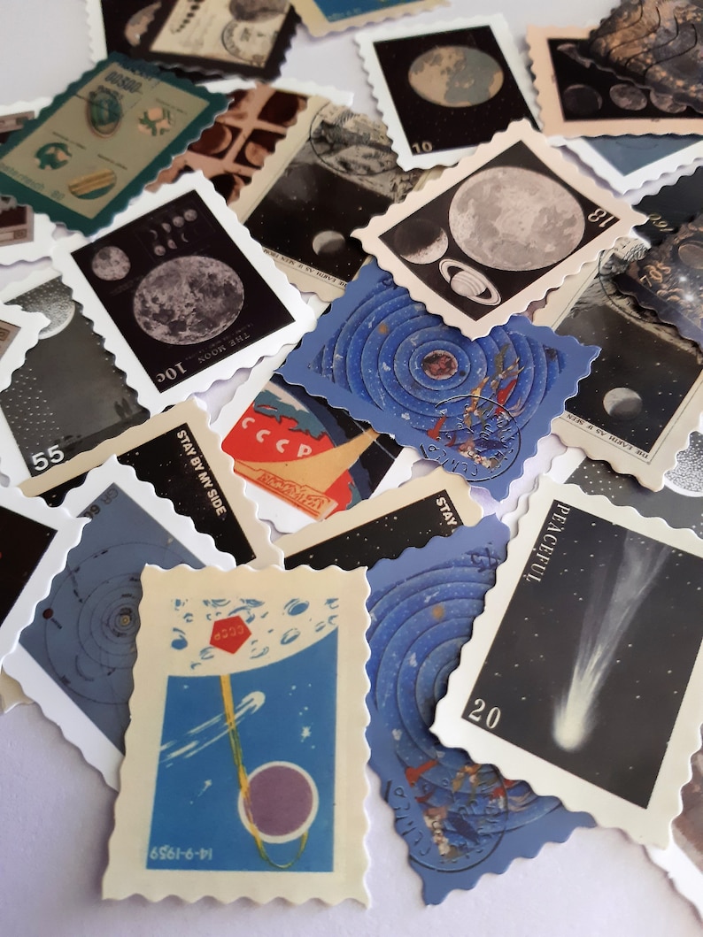 May include: A collection of vintage space-themed postage stamps featuring images of the moon, planets, and comets. The stamps are printed on blue, white, and black paper with various text, including "THE MOON 10c", "THE EARTH AS MEN", "CCCP", "STAY BY MY SIDE", "PEACEFUL", "STAY", and "16561-6-11".