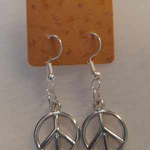 Silver Colour Earrings, 4 Styles to choose from (Peace, Moon, Dolphins or Holiday) in velvet bag. Hand Made