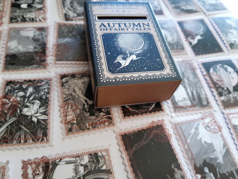 May include: A blue box with a white border and the text "Autumn of Fairy Tales" on the front. The box is decorated with a white silhouette of a horse and rider against a starry night sky.