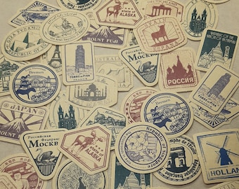 May include: A collection of vintage-style travel stickers featuring various landmarks and locations around the world. The stickers are printed on brown paper with a distressed look and feature illustrations of famous landmarks, including the Eiffel Tower, the Taj Mahal, the Great Wall of China, and the Statue of Liberty. The stickers also include text in various languages, such as "Japan", "Spain", "Russia", and "Australia".