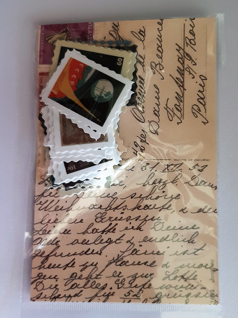 May include: A vintage postcard with handwritten text in black ink. The text reads "49, Avenue de la Douce  Beaunce  Tom Dempsey, Paris". The postcard is decorated with several vintage stamps, including one with a red, white, and blue design and the text "CCCP" and "60".