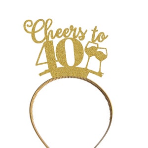 May include: Gold glitter headband with the text "Cheers to 40" and a wine glass graphic.