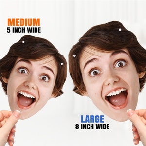 May include: Two cardboard cutouts of a person's face with an open mouth and wide eyes. The cutout on the left is labeled "MEDIUM 5 INCH WIDE" and the cutout on the right is labeled "LARGE 8 INCH WIDE".