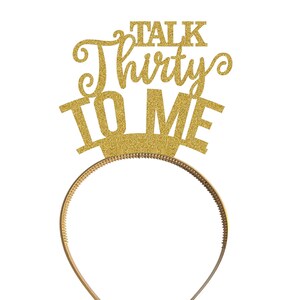 May include: Gold glitter headband with the text "Talk Thirty To Me" on it.