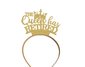 May include: Gold glitter headband with a crown and the text "The Queen has Retired".