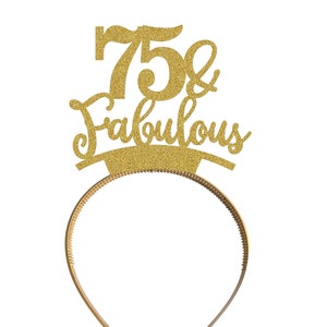 May include: Gold glitter headband with the text "75 & Fabulous" on it.