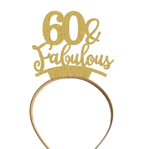 May include: Gold glitter headband with the text "60 & Fabulous" on it.