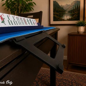 Black foldable 3D printed PLA hands-free mahjong card holder, slim compact footprint ideal for small card tables and tight game setups.