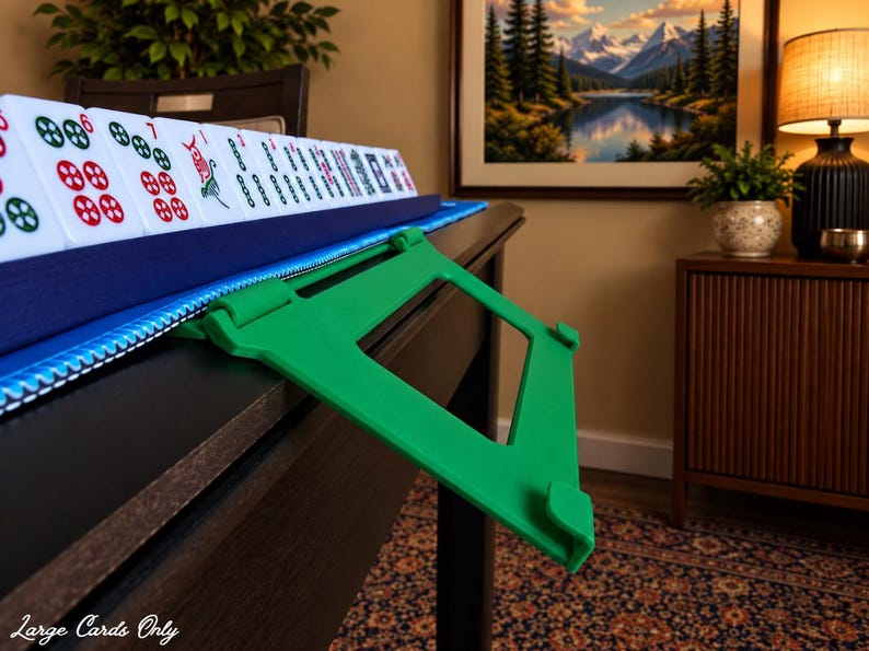 Green foldable 3D printed PLA hands-free mahjong card holder, slim compact footprint ideal for small card tables and tight game setups.