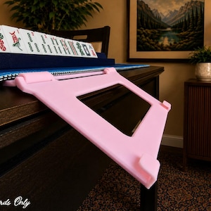 Soft Pink foldable 3D printed PLA hands-free mahjong card holder, slim compact footprint ideal for small card tables and tight game setups.