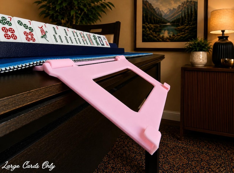 Soft Pink foldable 3D printed PLA hands-free mahjong card holder, slim compact footprint ideal for small card tables and tight game setups.