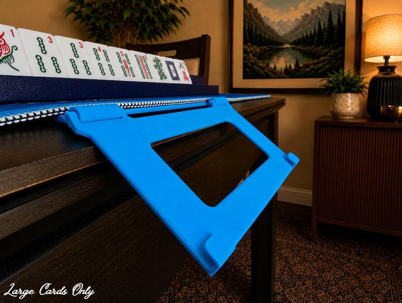 Cyan foldable 3D printed PLA hands-free mahjong card holder, slim compact footprint ideal for small card tables and tight game setups.