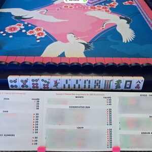 Pink foldable 3D printed PLA hands-free mahjong card holder, slim compact footprint ideal for small card tables and tight game setups.