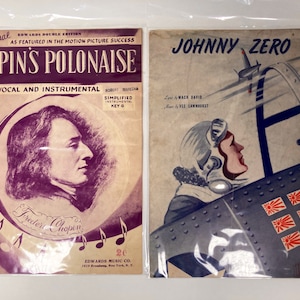 May include: Two vintage sheet music covers. The left cover features a portrait of Frederic Chopin and the title "Chopin's Polonaise". The right cover features a drawing of a pilot in a cockpit and the title "Johnny Zero".