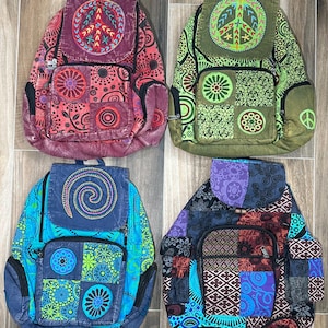 May include: A white ceramic mug with a black handle and the text "But First, Coffee" in a black, handwritten-style font. The mug is on a white surface.