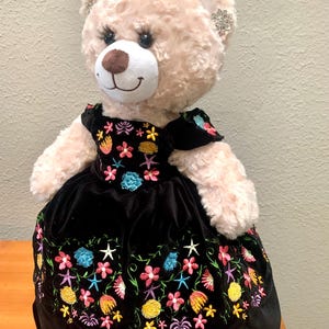 Quinceanera Princess Bear/Doll with black dress with multicolored embroidered flowers.