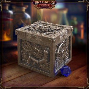May include: A steampunk-style wooden box with intricate gear and pipe detailing. The box is brown with metallic accents and features a blue, multi-sided die. The top of the box is covered in gears. The box has the text "Tiny Towers Fates End".