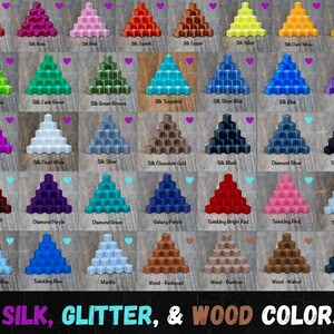 May include: A color chart featuring various pyramid-shaped samples in silk, glitter, and wood finishes. Colors include red, pink, green, blue, and gold, with labels such as "Silk Red" and "Wood-Ebony". The text "SILK, GLITTER, & WOOD COLORS" is at the bottom.