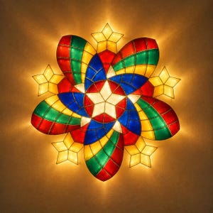 Op de afbeelding: Een stervormige lantaarn met een centrale witte ster omringd door zes grote, veelkleurige bloemblaadjes in rood, groen en blauw. Kleinere gele sterren bevinden zich tussen de bloemblaadjes, allemaal van binnenuit verlicht voor een warme gloed.